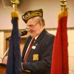 Ben Boettger/Peninsula Clarion Korean War veteran Herb Stettler gives his annual reading of the World War One memorial poem "Flanders Field" during a Veteran's Day ceremony on Friday, Nov. 11, 2016 at the Soldotna Regional Sports Complex in Soldotna.