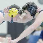 Photo by Jeff Helminiak/Peninsula Clarion Homer's Chris Cudaback and Colony's Eric Christy face off at 152 pounds Saturday in the championship dual at the Peninsula Duals at Nikiski High School. Christy notched a 3-1 decision.