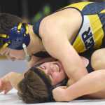 Photo by Jeff Helminiak/Peninsula Clarion Homer's Timmy Woo prepares to pin Colony's Frank Urbano at 160 pounds Saturday in the championship dual of the Peninsula Duals at Nikiski High School.