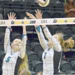 Photo by Joey Klecka/Peninsula Clarion Nikiski's Emily Hensley (5) and Bethany Carstens team up for a block against Mt. Edgecumbe in Saturday's Class 3A state volleyball championship at the Alaska Airlines Arena in Anchorage.