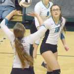 Photo by Joey Klecka/Peninsula Clarion Nikiski senior Ayla Pitt (center) and junior Jamie Yerkes keep an eye on the set play by sophomore Emma Wik against Mt. Edgecumbe in the Class 3A state volleyball championship Saturday at the Alaska Airlines Arena in Anchorage.