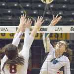 Photo by Joey Klecka/Peninsula Clarion Nikiski middle Ayla Pitt reaches for a ball against Mt. Edgecumbe's Daisy Hunt (8) Saturday in the Class 3A state volleyball championship at the Alaska Airlines Arena in Anchorage.