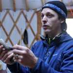 Ben Boettger/Peninsula Clarion Speaking to Seward Elementary students in a yurt near the cabin, Chugachmuit Native organization Local Education Coordinator Nick Jordan holds up a mountain goat horn - traditionally used by local Supiak Natives to made spoons and other utensils - during a field trip to Manitoba cabin on Tuesday, Nov. 15 near the Seward Highway.d