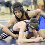 Photo by Jeff Helminiak/Peninsula Clarion Soldotna's Ben Booth controls Nikiski's Joey Yourkoski in an exhibition match at 106 pounds Wednesday at Soldotna Prep. Booth scored a 16-4 major decision.
