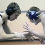 Photo by Jeff Helminiak/Peninsula Clarion Soldotna's Brayde Wolfe and Nikiski's Malcolm Yerkes prepare to engage at 126 pounds Wednesday at Soldotna Prep. Wolfe was able to pin Yerkes.