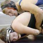 Photo by Jeff Helminiak/Peninsula Clarion Soldotna's Austin Schrader controls Nikiski's Dustin Mullins at 182 pounds Wednesday at Soldotna Prep. Schrader would earn a pin in the third period.