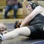 Photo by Jeff Helminiak/Peninsula Clarion Nikiski's Ethan Hack prepares to pin Soldotna's Eli Floyd in an exhibtion match at 220 pounds Wednesday at Soldotna Prep.