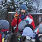 Seward Elementary teacher Jason Leslie counts students before crossing a creek to Manitoba cabin during a field trip on Tuesday, Nov. 11 near the Seward Highway.