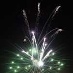 Photo by Megan Pacer/Peninsula Clarion Onlookers take in fireworks being set off above the Kenai Chamber of Commerce and Visitor Center during the finale of this yera's Christmas Comes to Kenai celebration Friday, Nov. 25, 2016 in Keneai, Alaska.
