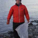 Rotarian Dr. Matt Pyhala joins the annual clean-up effort at Rotary Park.