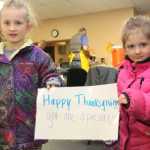 6-year-old Elodie and 4-year-old Behati Frisk some up the perfect Thanksgiving message.