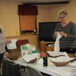 Families work together to be sure everyone has a Happy Thanksgiving dinner.