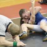 Photo by Jeff Helminiak/Peninsula Clarion Soldotna's Logan Craig works his way to a pin of Kenai Central's Pierce Peterson at Kenai Central High School on Thursday.