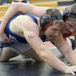 Photo by Jeff Helminiak/Peninsula Clarion Kenai Central's Byron Dunham tries to control Soldotna's Austin Schrader at 195 on Thursday at Kenai Central High School. Schrader scored a 6-4 sudden victory.