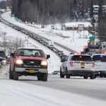 Photo by Megan Pacer/Peninsula Clarion Soldotna Police officers block off part of the Sterling Highway following a two-vehicle collision Thursday, Dec. 8, 2016 near the intersection of the highway and Mackey Lake Road in Soldotna, Alaska. One person was killed in the crash and the other taken to Central Peninsula Hospital to be treated for injuries.