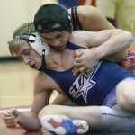 Photo by Jeff Helminiak/Peninsula Clarion Soldotna's Bechler Metcalf and Kenai Central's Keyshawn McEnerney battle in a dual meet at Kenai Central on Dec. 1. McEnerney is ranked first at 152 pounds at Class 4A and Metcalf is fourth entering the Northern Lights Conference tournament this weekend.