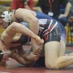 Photo by Joey Klecka/Peninsula Clarion Bechler Metcalf of Soldotna wrestles with Wasilla's Andrue Shepersky in the 152-pound championship bout at the Northern Lights Conference tournament Saturday at Kenai Central High School.