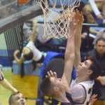 Photo by Jeff Helminiak/Peninsula Clarion Soldotna's Sam McElroy goes up for a shot against Ninilchik's Austin White on Friday at Soldotna High School.