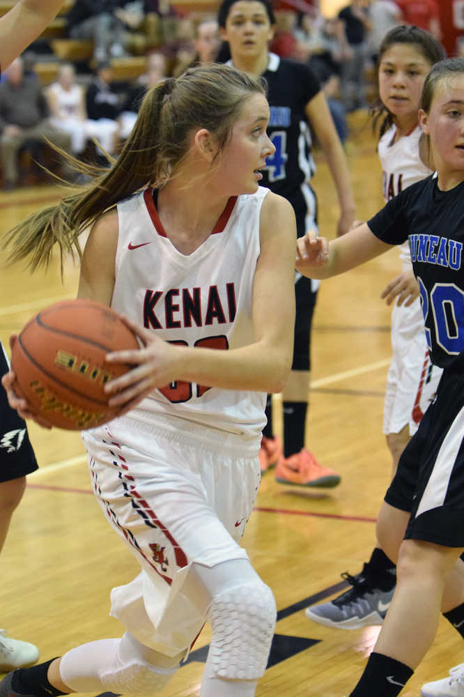 Photo by Jeff Helminiak/Peninsula Clarion Kenai Central's Brooke Satathite looks for an opening Friday against Thunder Mountain at Kenai Central High School. Satathite had a game-high 23 points.