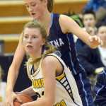 Photo by Jeff Helminiak/Peninsula Clarion Homer's Alissa Cole tries to protect the ball from Danica Schmidt of Soldotna on Friday at Kenai Central High School.