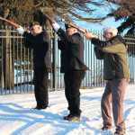 Photo by Megan Pacer/Peninsula Clarion A wreath adorns a steak marking the grave of a veteran while volunteers hang dozens more Saturday, Dec. 17, 2016 at the Kenai Municipal Cemetery in Kenai, Alaska. Bob Myles, a member of the VFW and American Legion, coordinated the peninsula's first wreath ceremony through the Wreaths Across America program. Community members hung wreaths on the graves of veterans in the Kenai and Soldotna cemeteries, and Myles is working to expand the event to more peninsula cemeteries next year.