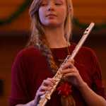 Photo by Ben Boettger/Peninsula Clarion Nicole Reid plays a solo piece in a flute and violin concert on Saturday, Dec. 17 at Christ Lutheran Church in Soldotna. The free concert featured the students of flautist Tomoka Raften and violinist Ida Pearson.