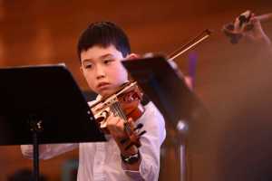 Photo by Ben Boettger/Peninsula Clarion Vanessa Wilkison, a member of the Anchorage-based Fireweed Flutes quartet, performs a solo piece on Saturday, Dec. 17 at Christ Lutheran Church in Kenai. Wilkison traveled to Kenai to play in a free flute and violin concert featuring students of flautist Tomoka Raften and violinist Ida Pearson.
