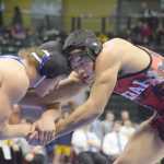 Photo by Joey Klecka/Peninsula Clarion Kenai Central senior Keyshawn McEnerny battles with Levi Farris of Palmer in the Class 4A state wrestling championship 152-pound bout, Saturday night at the Alaska Airlines Center in Anchorage.