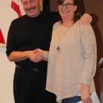 Kenai Peninsula Association of Realtors president Marti Pepper congratulates Mark White, 2016 Realtor of the Year.