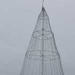 HEA's boom truck sets the Soldotna tree on its perch.