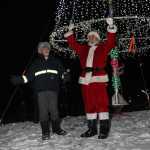 Santa magically illumines the Soldotna Creek tree.