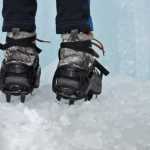 Photo by Elizabeth Earl/Peninsula Clarion Avery Walden, 9, stands before an ice wall her father set up in the back yard of their home on Sunday, Dec. 18, 2016 near Soldotna, Alaska. Her father, Chris Walden, had to custom-make her ice cleats from a larger set. "Mountaineering gear for kids doesn't exist, so a lot of times you have to fabricate stuff, weld stuff, make stuff," he said. Avery and Chris Walden, along with a family friend, will embark on an eight-day expedition to summit Mt. Kilimanjaro in Tanzania. If they succeed, Avery Walden will be the youngest female ever to summit the 19,341-foot mountain.