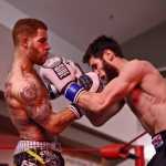 Ben Boettger/Peninsula Clarion Kickboxers Jay Harris (left) and Codyne Williams fight in the main event of the Fight Before Christmas martial arts event on Thursday, Dec. 22 at Soldotna's Peninsula Center Mall. Harris beat Williams by decision of the judges.