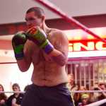 Ben Boettger/Peninsula Clarion Boxer Quinton Kennedy stands ready in his match against Doug Machado in the Fight Before Christmas martial arts event on Thursday, Dec. 22 at Soldotna's Peninsula Center mall.