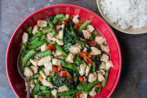 This November 2016 photo shows chicken and vegetable stir fry in New York. This dish is from a recipe by Katie Workman. (Sarah Crowder via AP)