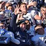 Photo by Joey Klecka/Peninsula Clarion Soldotna head coach Galen Brantley Jr. (center with dark jacket) celebrates with his players after winning a school-record fifth straight state football championship, Oct. 15 at Palmer High School. The Stars defeated the Palmer Moose 49-13.