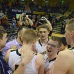 Photo by Joey Klecka/Peninsula Clarion The Ninilchik boys celebrate winning the Class 1A state tournament championship, March 19 over Nikolaevsk. The title was the first for the Ninilchik boys in school history.
