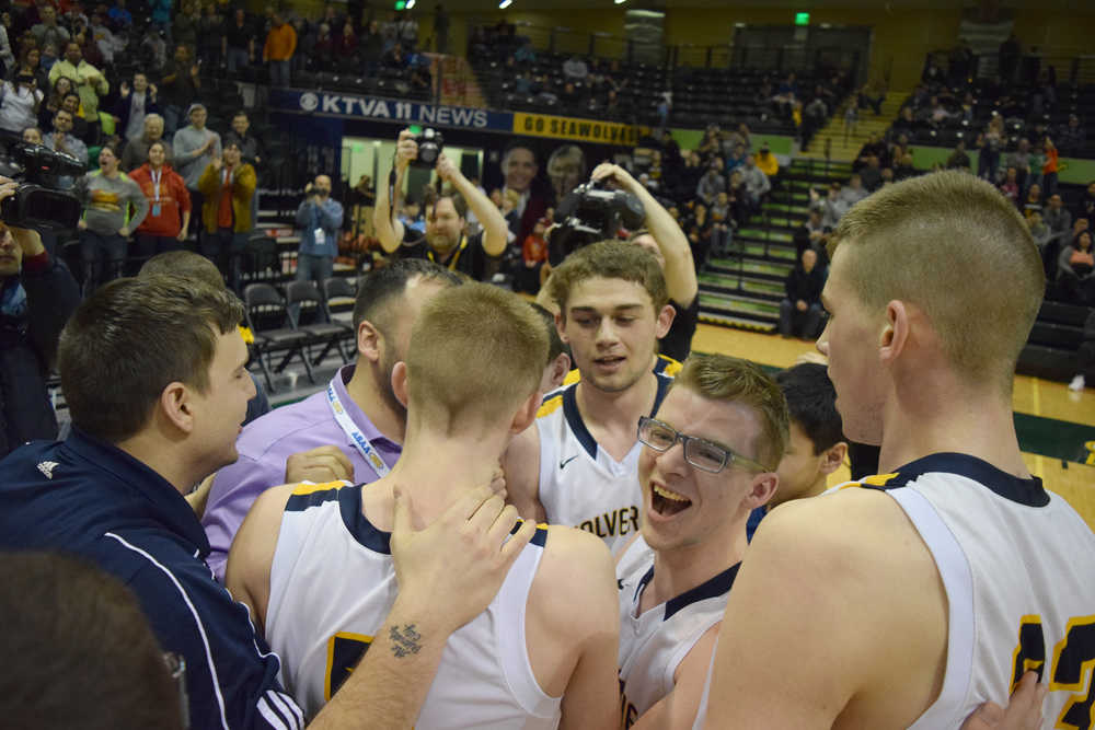 Photo by Joey Klecka/Peninsula Clarion The Ninilchik boys celebrate winning the Class 1A state tournament championship, March 19 over Nikolaevsk. The title was the first for the Ninilchik boys in school history.