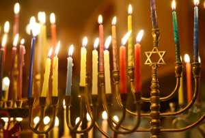 Ben Boettger/Peninsula Clarion Menorah candles glow for Hanukkah, lit by members of the Kenai Peninsula's Briat Elohim Jewish congregation in a celebration at the home of member Allison Gottesman on Friday, Dec. 30 near Kenai. This past Sunday was the final day of Hanukkah.