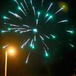 Photo by Elizabeth Earl/Peninsula Clarion The Northern Lights appear over the bluff as fireworks erupt in celebration of New Year's Eve on Saturday, Dec. 31, 2016 in Kenai, Alaska.