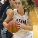 Photo by Jeff Helminiak/Peninsula Clarion Kenai Central's Rebecca Satathite gets past Nikiski's Brianna Vollertsen on Thursday at Kenai Central High School.