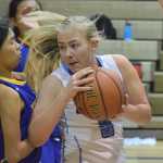 Photo by Joey Klecka/Peninsula Clarion Soldotna junior Melia Miller (front) works the paint against Kodiak in a Northern Lights Conference game Saturday at the Soldotna Prep gymnasium.