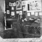 Writing desk corner – south-east / Father asleep on couch circa 1898-1900. This room was probably on the second floor of the two-story Bracketts Trading Post, otherwise known as the Mansion House, located on the northwest corner of 3rd Avenue and Main Street in Skagway. (Courtesy Photo | National Park Service, Klondike Gold Rush National Historical Park, Brackett Family Collection, BRSGY049, KLGO BI-45-5246)