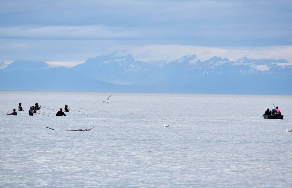 Boaters and shore-based personal-use dipnet fishermen try their luck for sockeye during a high tide at the mouth of the Kasilof River on Tuesday, July 31, 2018 in Kasilof, Alaska. (Photo by Elizabeth Earl/Peninsula Clarion)