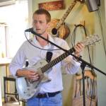 Ryan Hiller performs at Veronicas Cafe for open mic night on Friday, Aug. 3, 2018, in Kenai, Alaska. Through the month of August, tips collected at Fridays open mic nights from 6-8 p.m. will go to support community member, Vickie Tinker, who is fighting ovarian cancer. (Photo by Victoria Petersen/Peninsula Clarion)