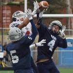 Soldotna defenders Luke Trammell (5) and Jersey Truesdell team up to cover North Pole receiver Jamie Johnson (middle), Oct. 7, 2017, at the ASAA First National Bank state football semifinals at Palmer High School. (Photo by Joey Klecka/Peninsula Clarion)