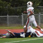 Galen Brantley III celebrates a touchdown on the turf Friday against West Anchorage at Justin Maile Field in Soldotna. (Photo by Joey Klecka/Peninsula Clarion)