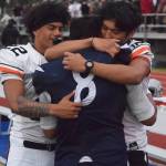 Soldotna junior Aaron Faletoi (8) is comforted by West player Zach Tiu following SoHis loss to West, Friday at Justin Maile Field in Soldotna. (Photo by Joey Klecka/Peninsula Clarion)