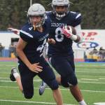 Soldotna junior Aaron Faletoi follows the block by teammate Jersey Truesdell Friday against West Anchorage at Justin Maile Field in Soldotna. (Photo by Joey Klecka/Peninsula Clarion)