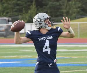 Soldotna junior Jersey Truesdell winds up for a pass Friday against North Pole at Soldotnas Justin Maile Field. (Photo by Joey Klecka/Peninsula Clarion)